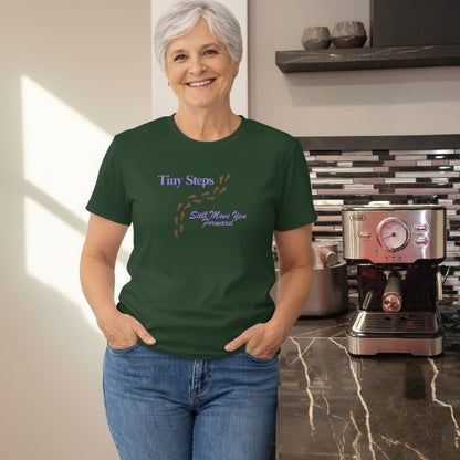 Jena Jewelry dark green 100% cotton t-shirt with purple text and brown footprints graphic.