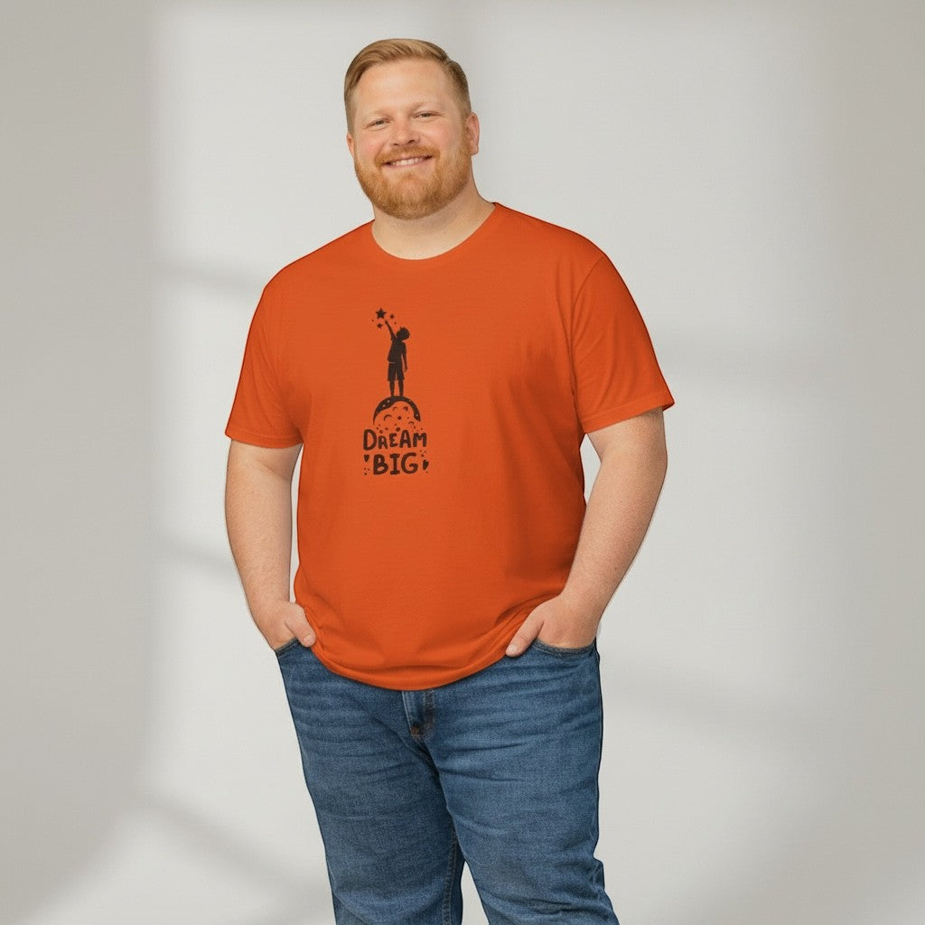 Jena Jewelry orange cotton t-shirt with "Dream Big" graphic of child reaching for stars on a cloud.