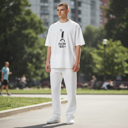 Jena Jewelry white cotton graphic t-shirt with "Dream Big" text and child reaching for stars graphic.