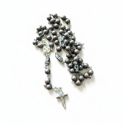 Jena Jewelry hand-wrapped rosary with ebony blackwood mala beads, hand-carved wood accent beads, and a base metal crucifix.