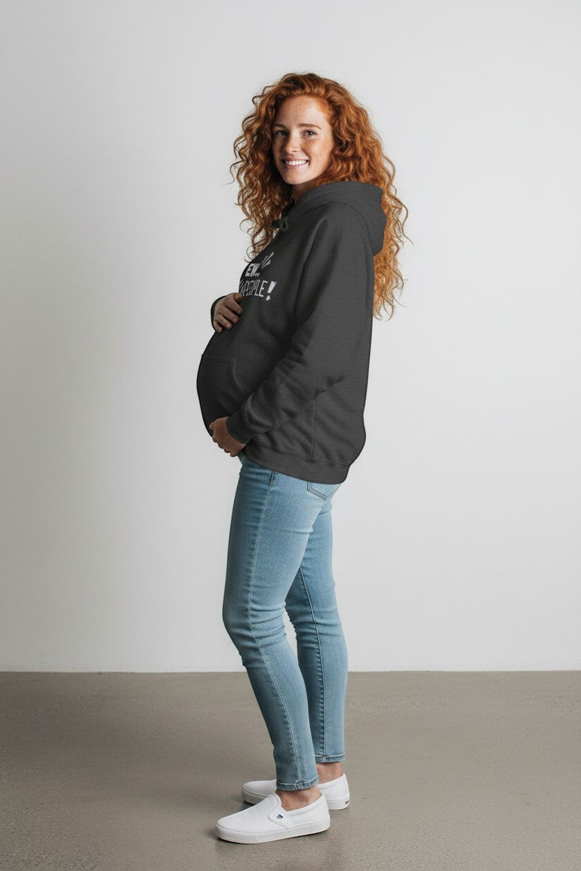 Pregnant woman in a dark grey cotton-poly blend hoodie with "EW... PEOPLE!" graphic print, paired with light wash jeans.