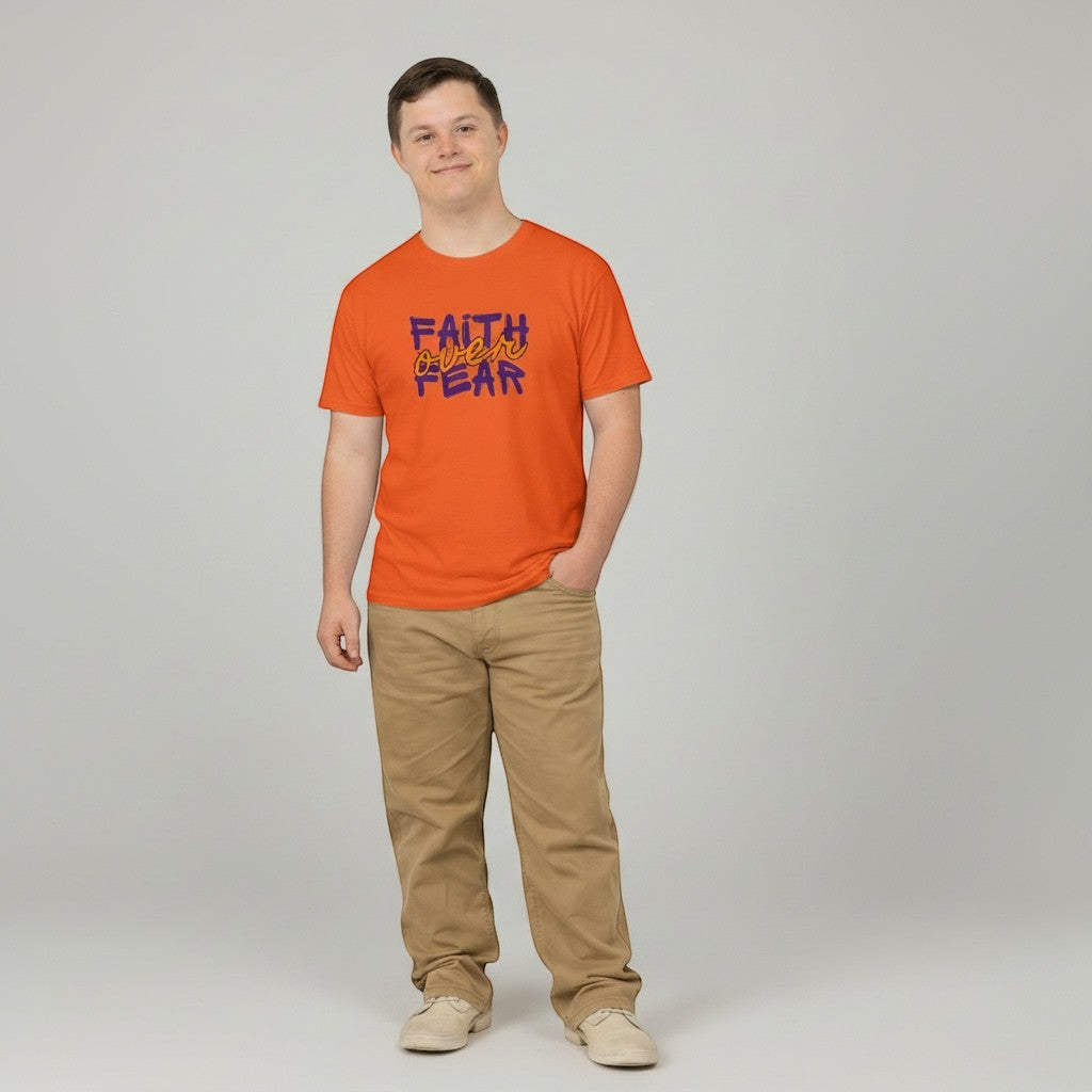 Jena Jewelry orange cotton t-shirt with purple and orange "FAITH over FEAR" graphic. Model wears tan pants.