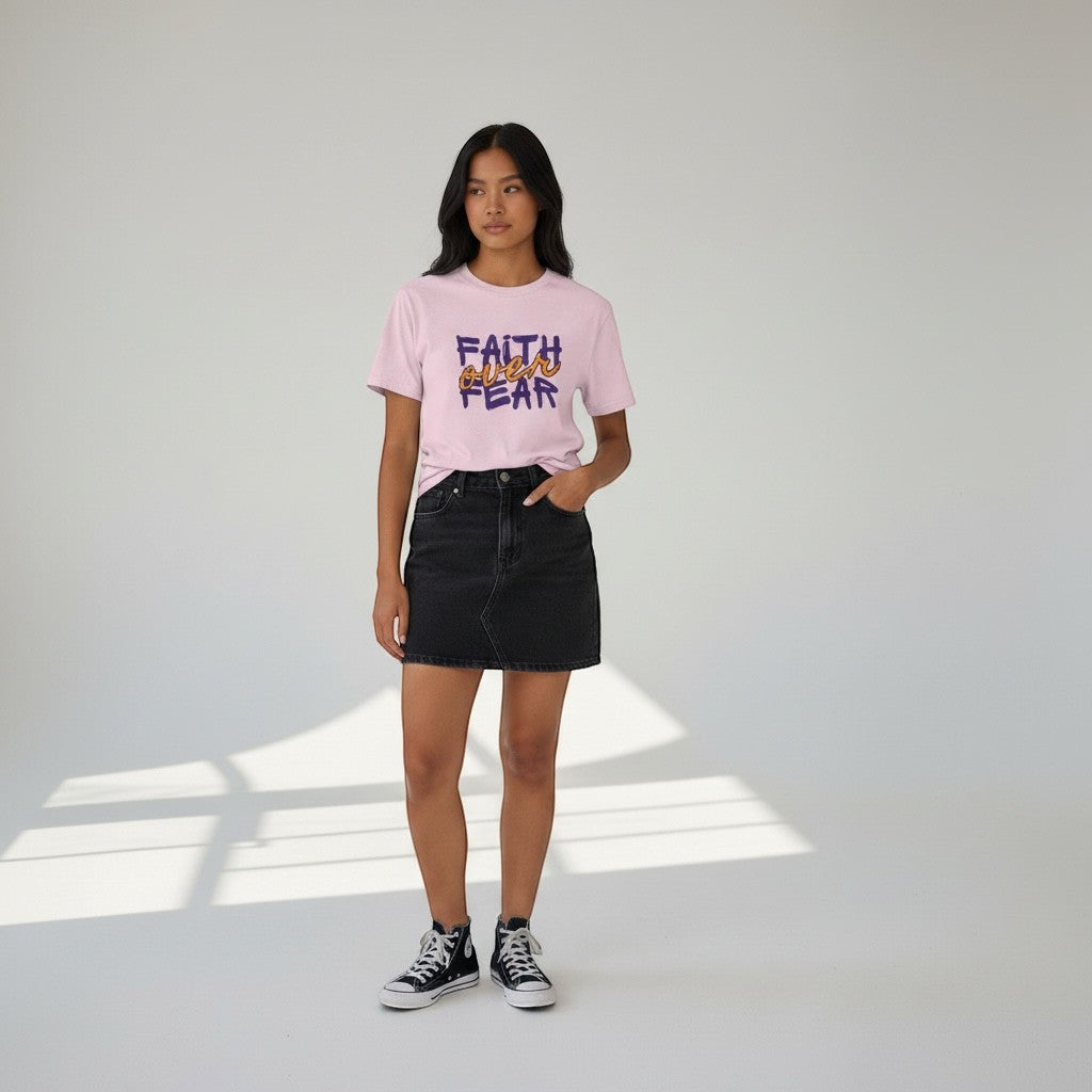 Jena Jewelry light pink cotton t-shirt with "FAITH over FEAR" graphic in purple and orange.