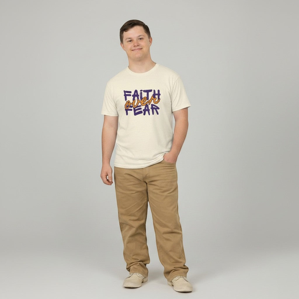 Jena Jewelry cream cotton t-shirt with purple and orange "FAITH over FEAR" graphic. Model is wearing khaki pants.