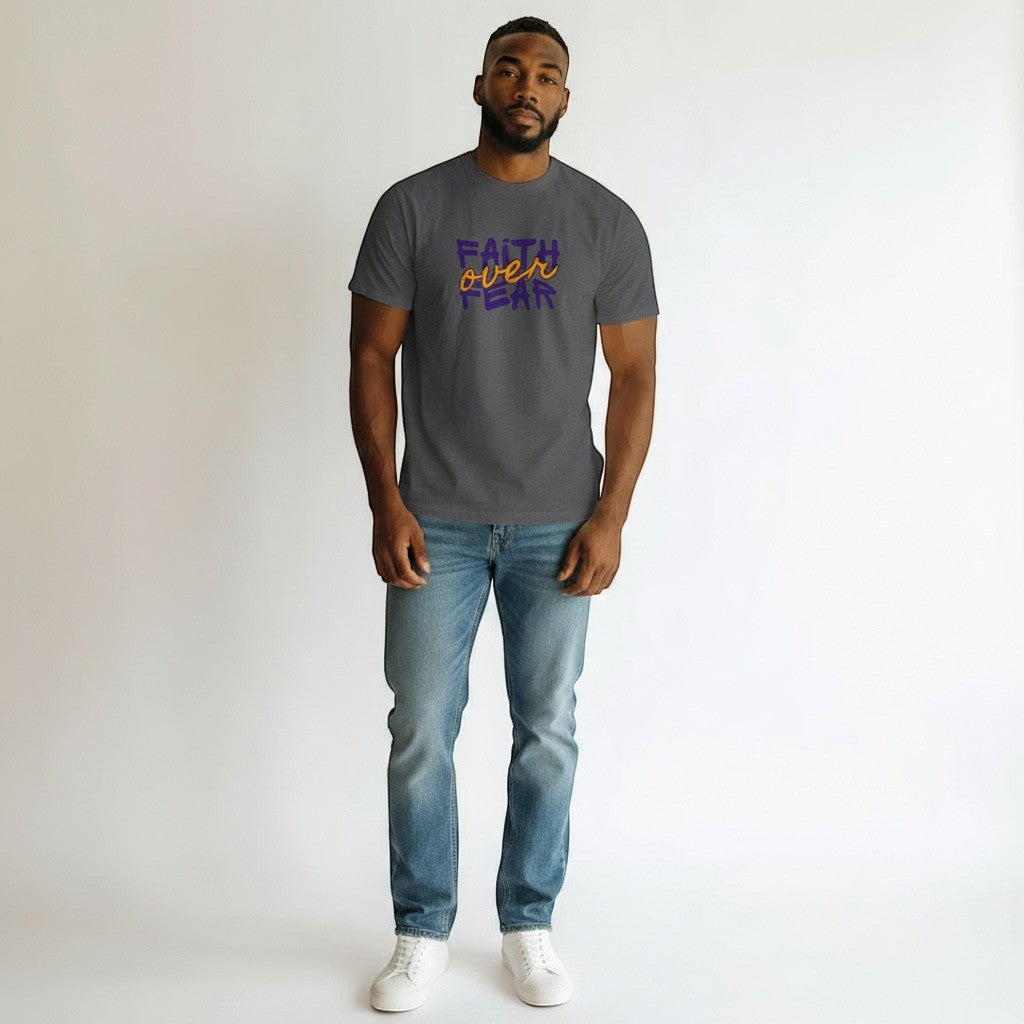 Jena Jewelry dark grey cotton t-shirt with purple and orange "Faith Over Fear" graphic. Model is wearing jeans and white sneakers.