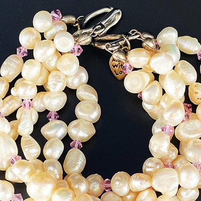 Jena Jewelry 6-strand freshwater pearl bracelet with pink crystals and silver clasp, perfect for bridal occasions.