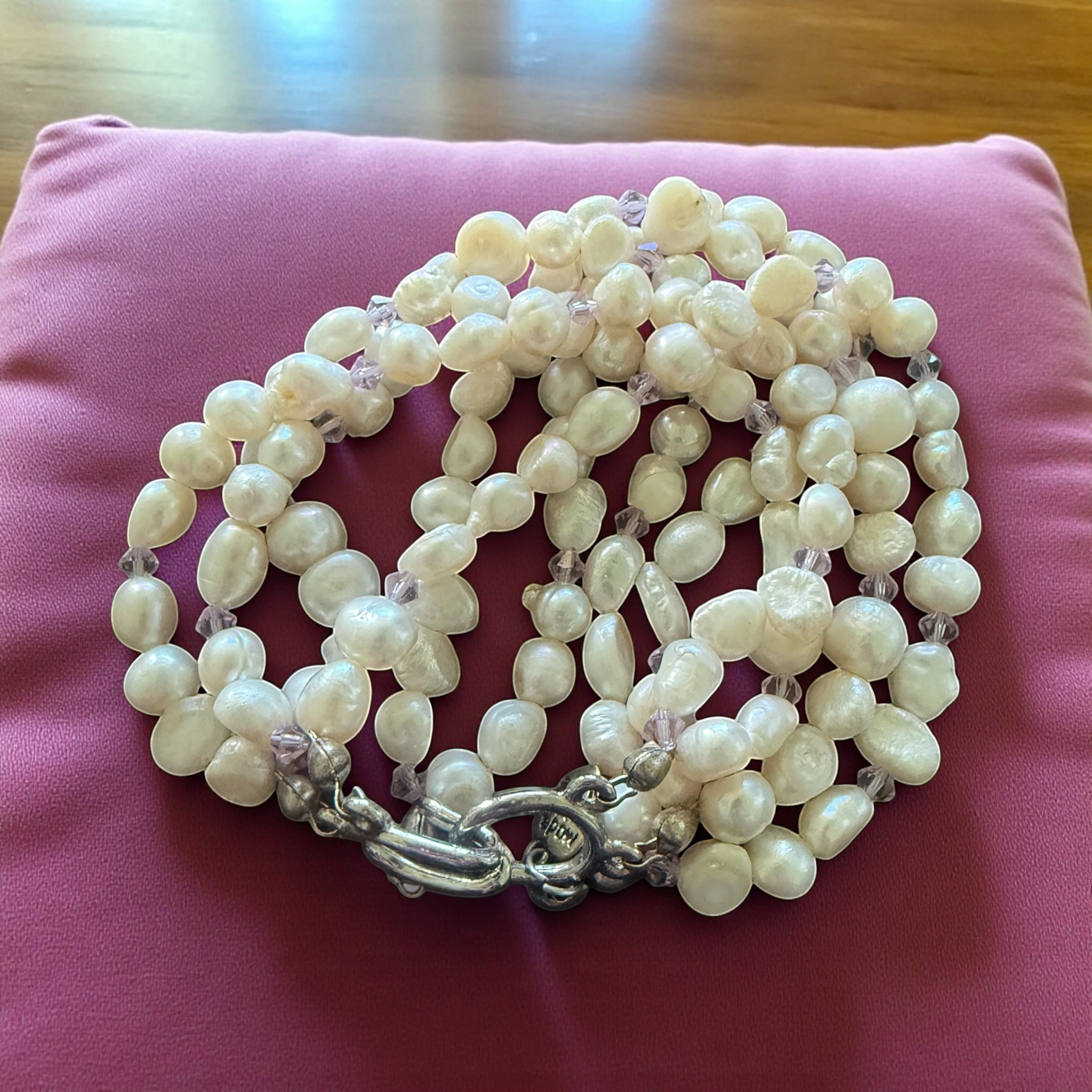 Jena Jewelry 6-strand freshwater pearl bracelet with purple crystals and silver clasp. Classic and romantic style.