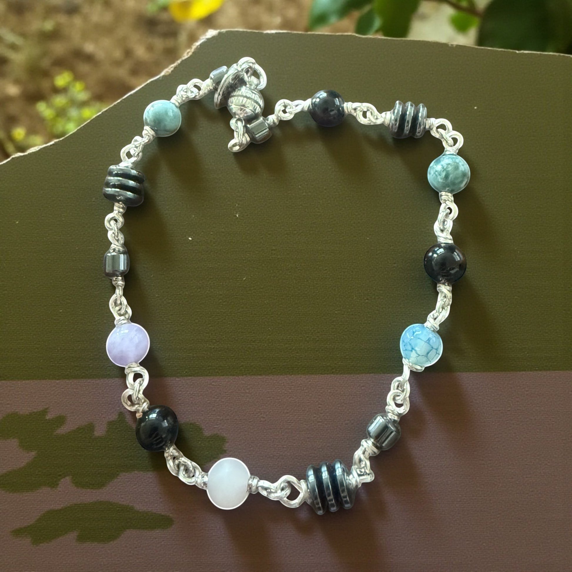 Jena Jewelry anklet with Hematite, Rose Quartz, Indigo, Black Onyx, and Jasper beads. Silver chain.