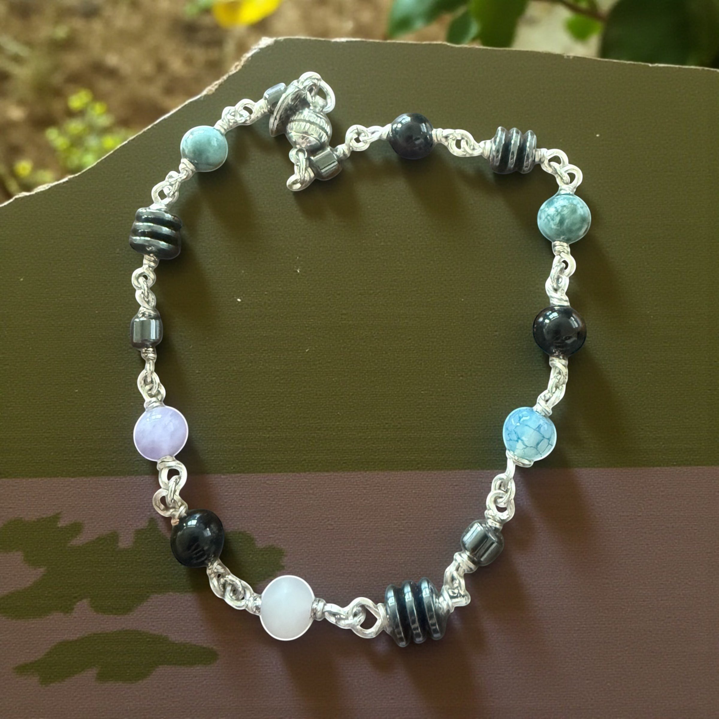 Jena Jewelry anklet with Hematite, Rose Quartz, Indigo, Black Onyx, and Jasper beads. Silver chain.