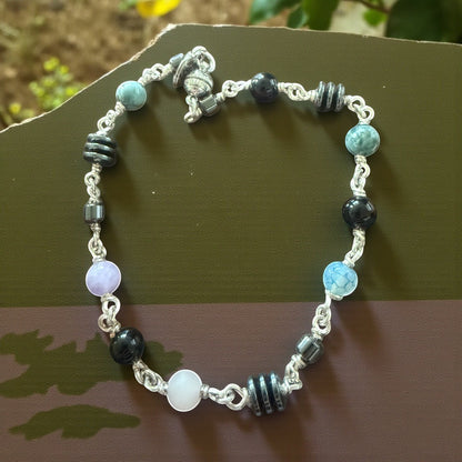 Jena Jewelry anklet with Hematite, Rose Quartz, Indigo, Black Onyx, and Jasper beads. Silver chain.
