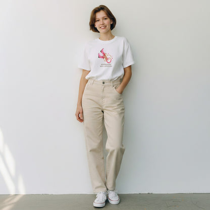 Jena Jewelry white cotton graphic tee with pink cowboy boots, lasso, and hearts graphic. Text reads 'Sunshine Mixed With A Little Wild'.