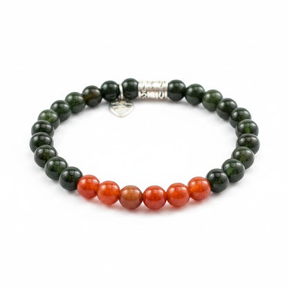 Jena Jewelry stretch bracelet with deep green jade and carnelian beads, silver accent bead and heart charm.