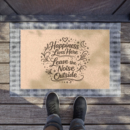 Jena Jewelry coir doormat with "Happiness Lives Here Leave the Noise Outside" text and decorative elements. Features a blue and white plaid border.