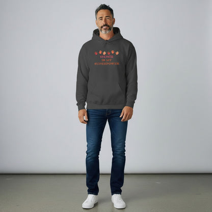 Dark grey cotton-poly blend hoodie with "KINDNESS IS MY SUPERPOWER" text and colorful handprints graphic.