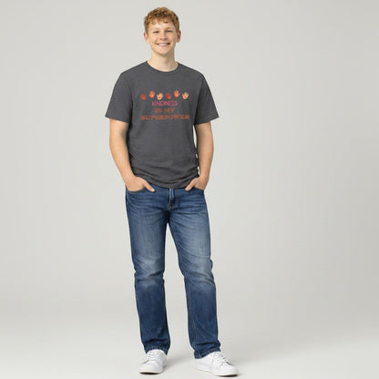 Jena Jewelry dark grey 100% cotton t-shirt with "Kindness Is My Superpower" graphic and colorful handprints.