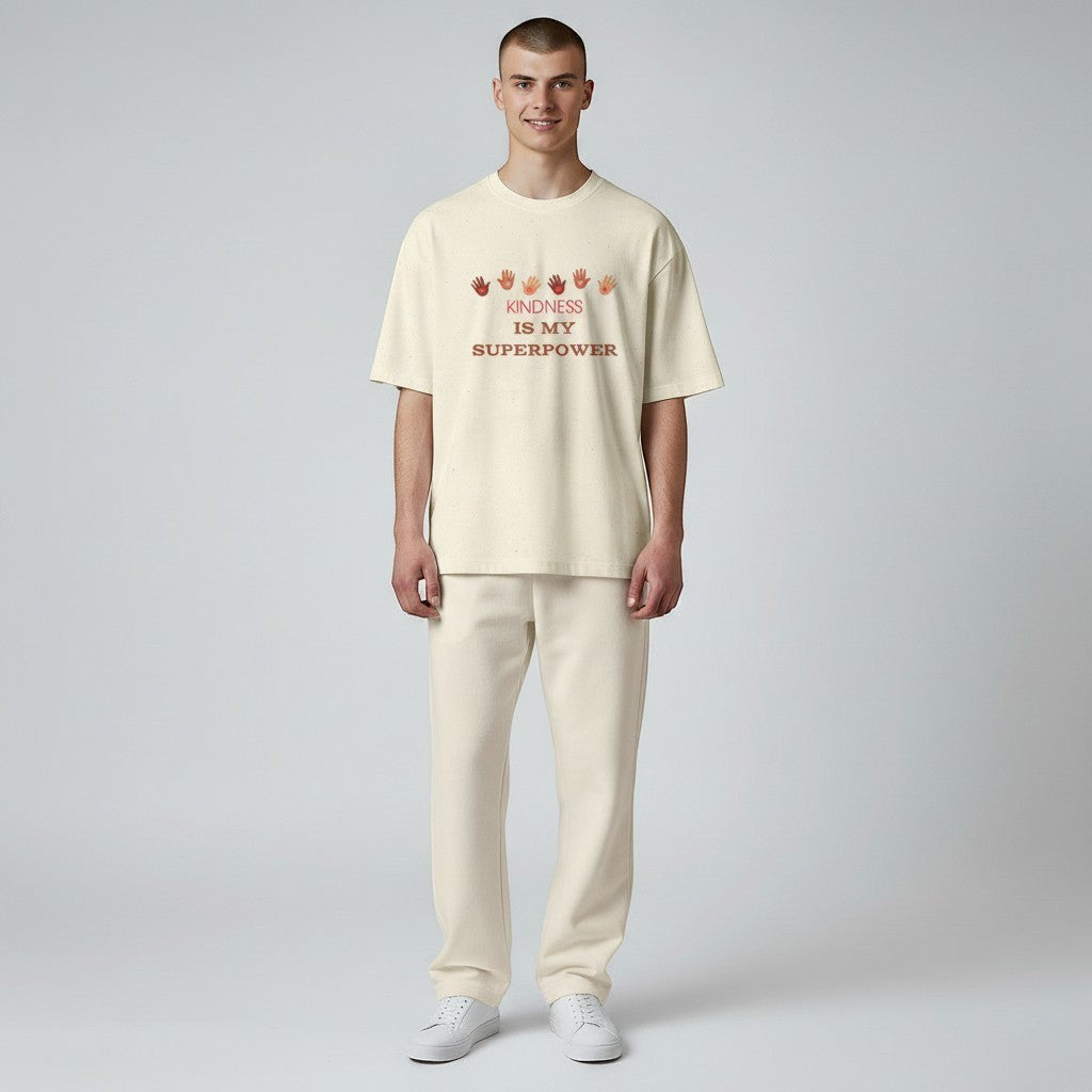 Jena Jewelry cream cotton t-shirt with "Kindness Is My Superpower" graphic and handprints.