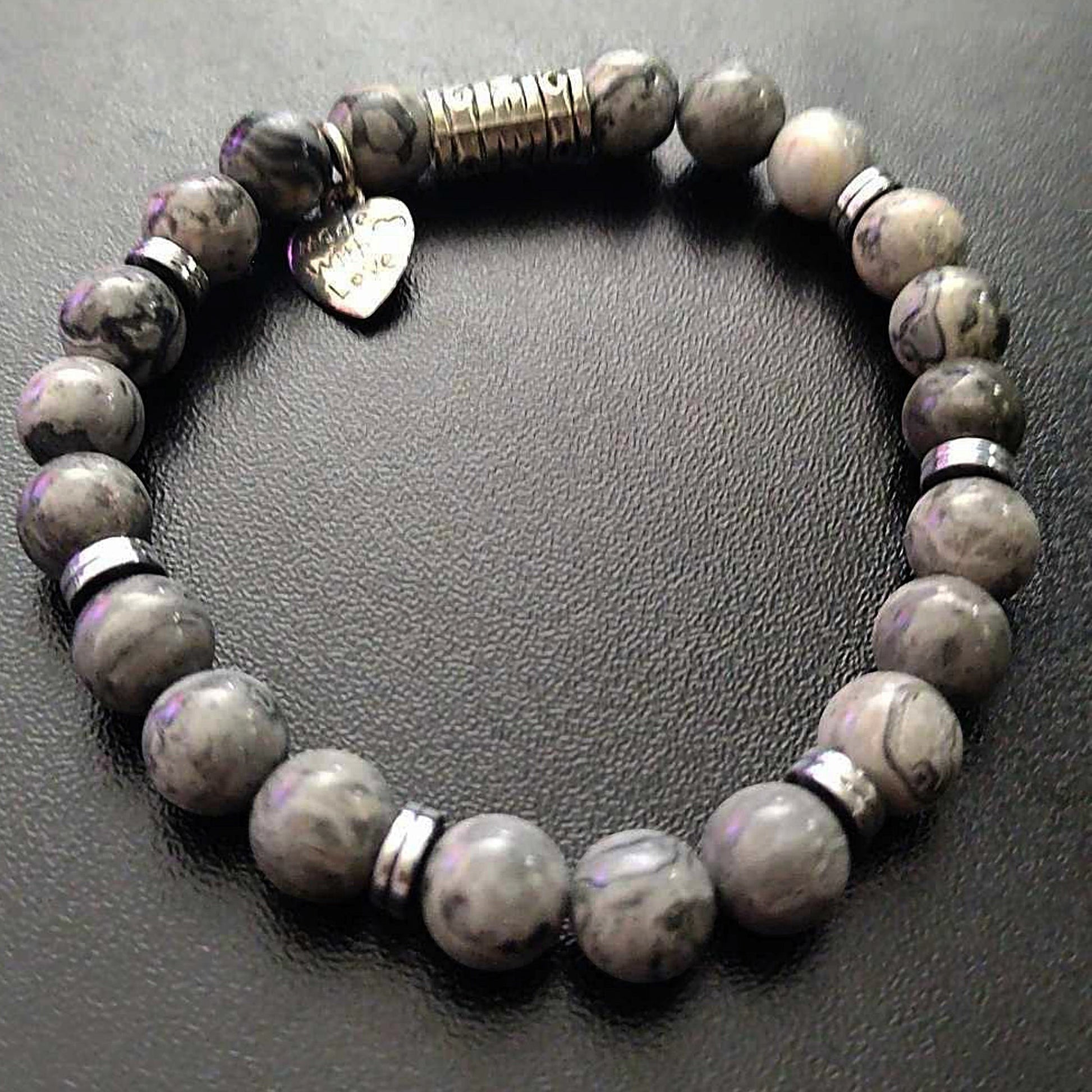 Jena Jewelry grey beaded stretch bracelet with hematite disk and heart charm.