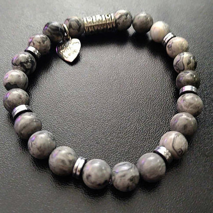 Jena Jewelry grey beaded stretch bracelet with hematite disk and heart charm.