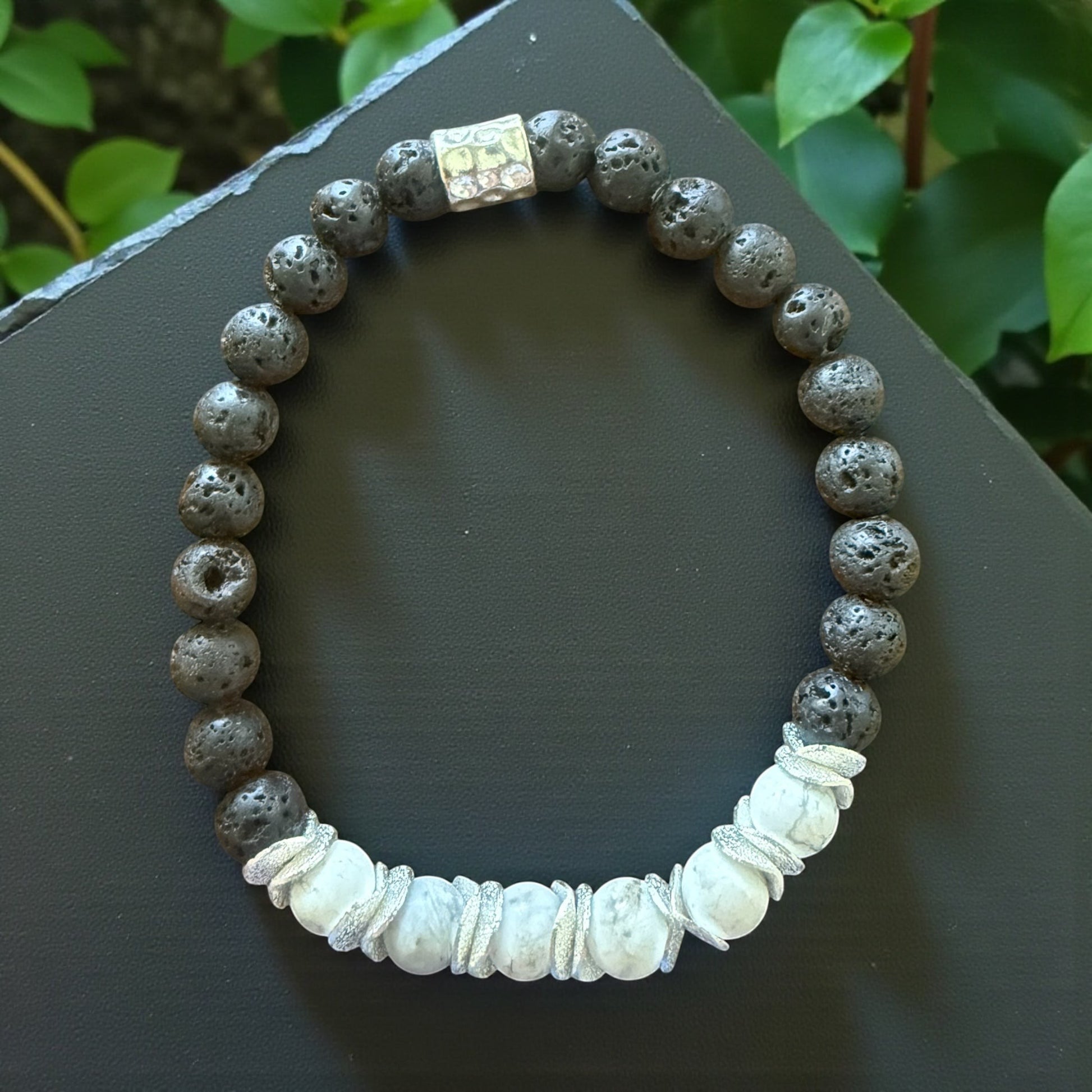 Jena Jewelry lava stone and howlite stretch bracelet with silver accent bead. Grounding and calming.