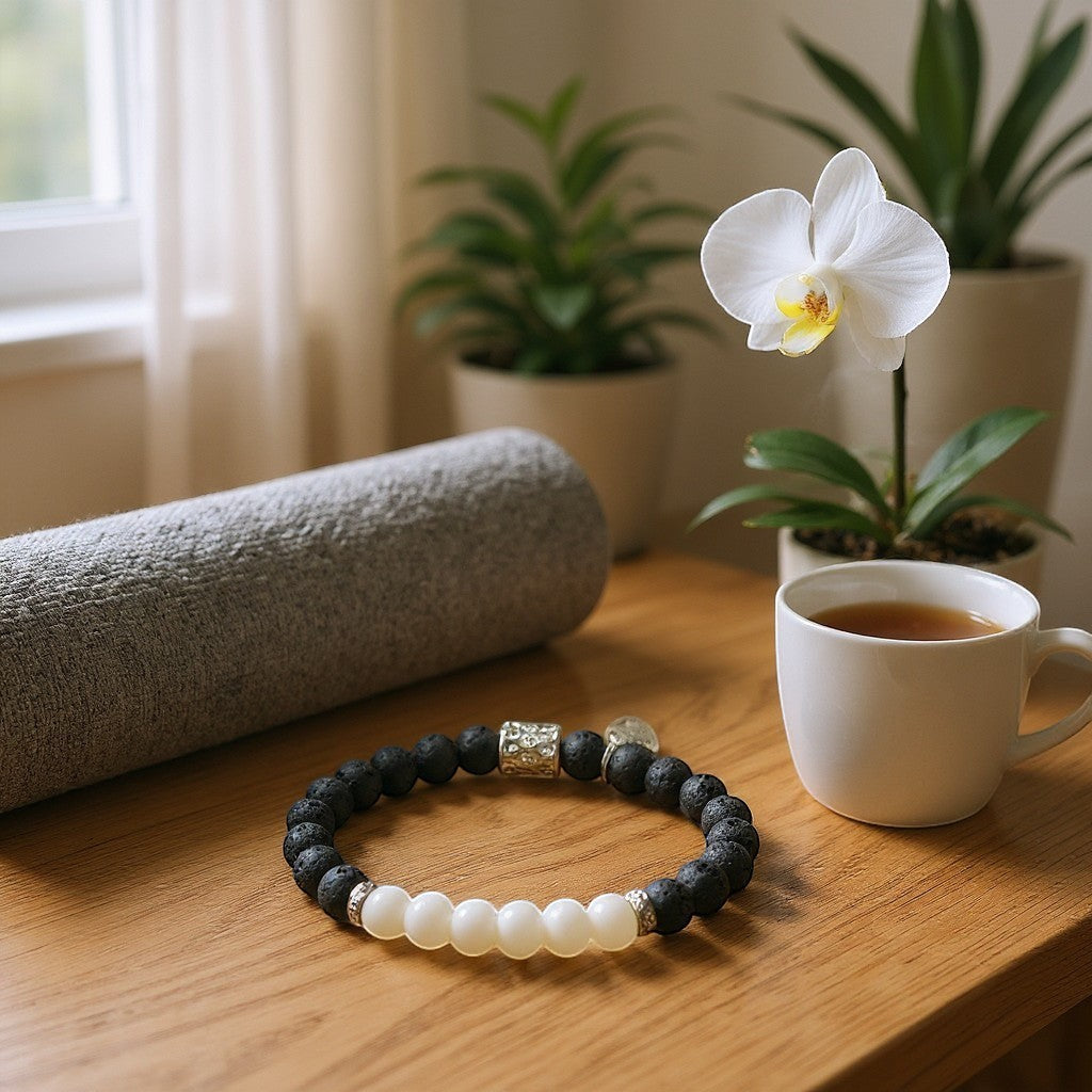 Jena Jewelry handmade stretch bracelet with black lava stones and white jade beads, silver accent bead.
