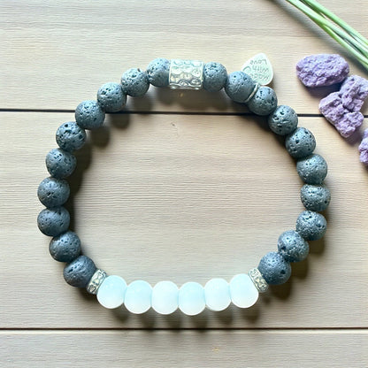 Jena Jewelry stretch bracelet with grey lava stone, white jade, and hematite accent beads. Ideal for grounding and clarity.