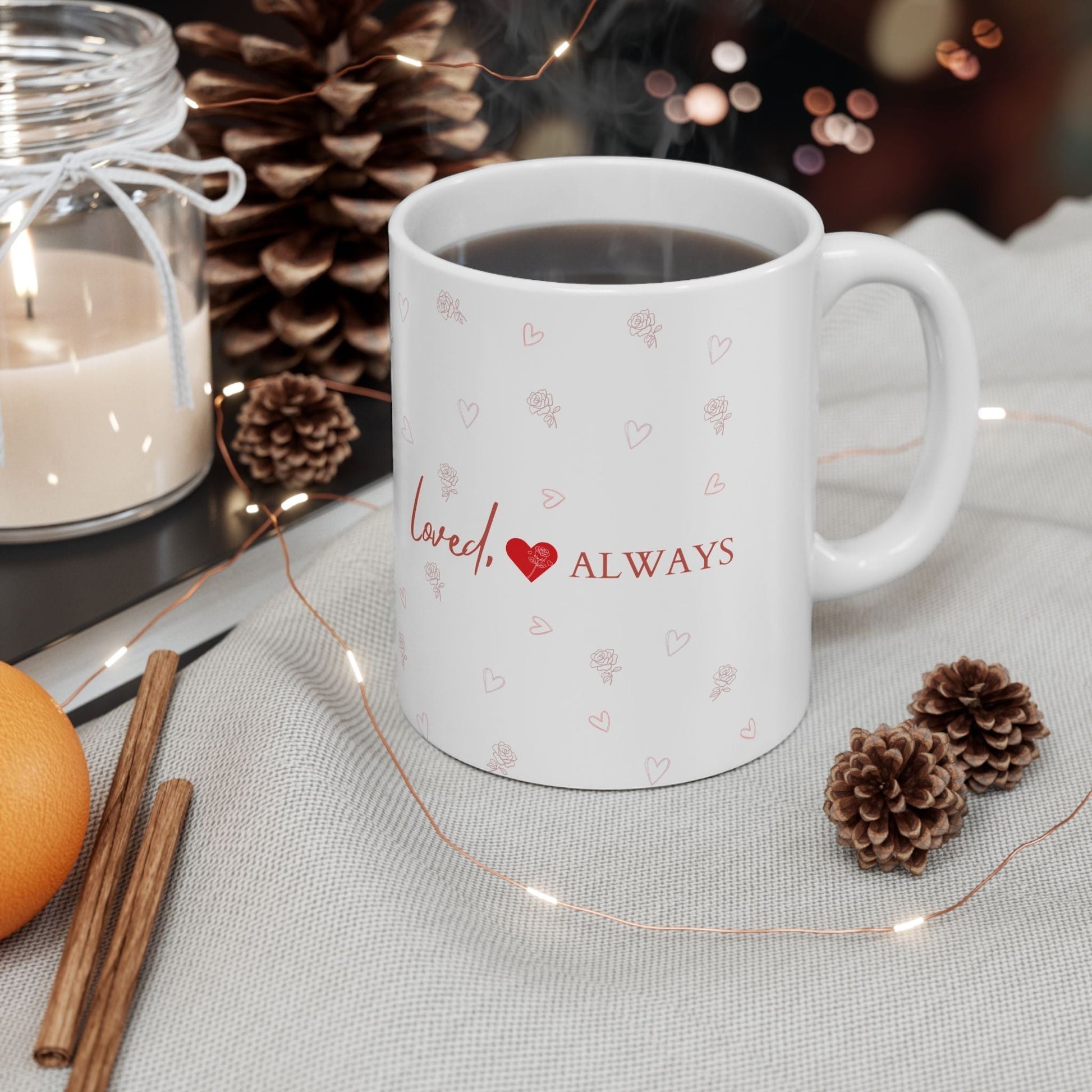 Jena Jewelry white ceramic mug with "Loved Always" text and heart-rose pattern, perfect for romantic gifts.