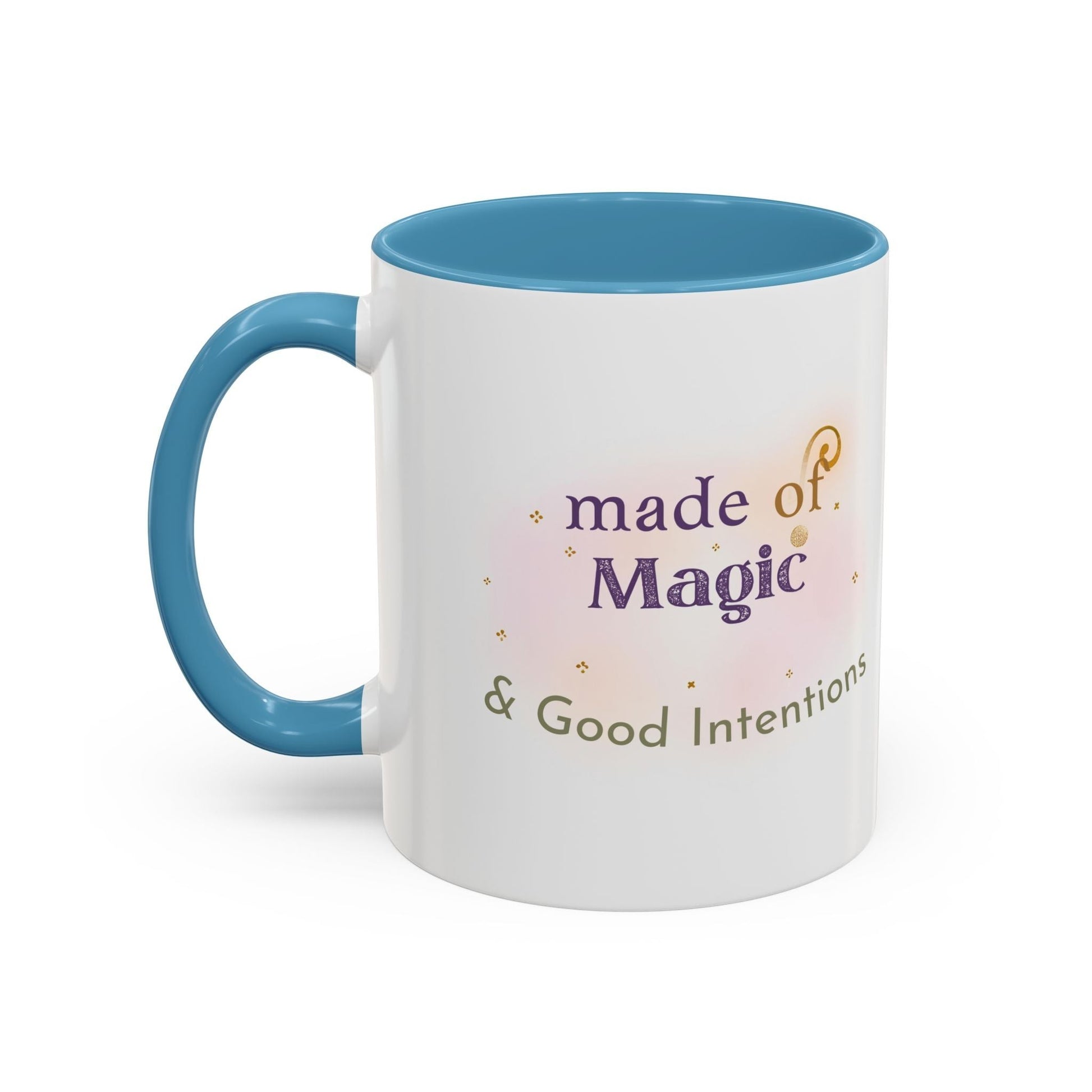 Jena Jewelry white ceramic mug with blue interior and handle, featuring "made of Magic & Good Intentions" text and watercolor design.