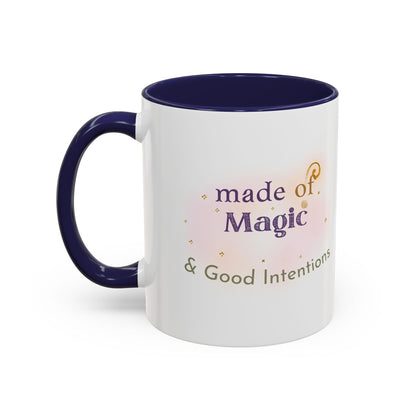 Jena Jewelry white ceramic mug with navy blue interior and handle, featuring "made of Magic & Good Intentions" text.