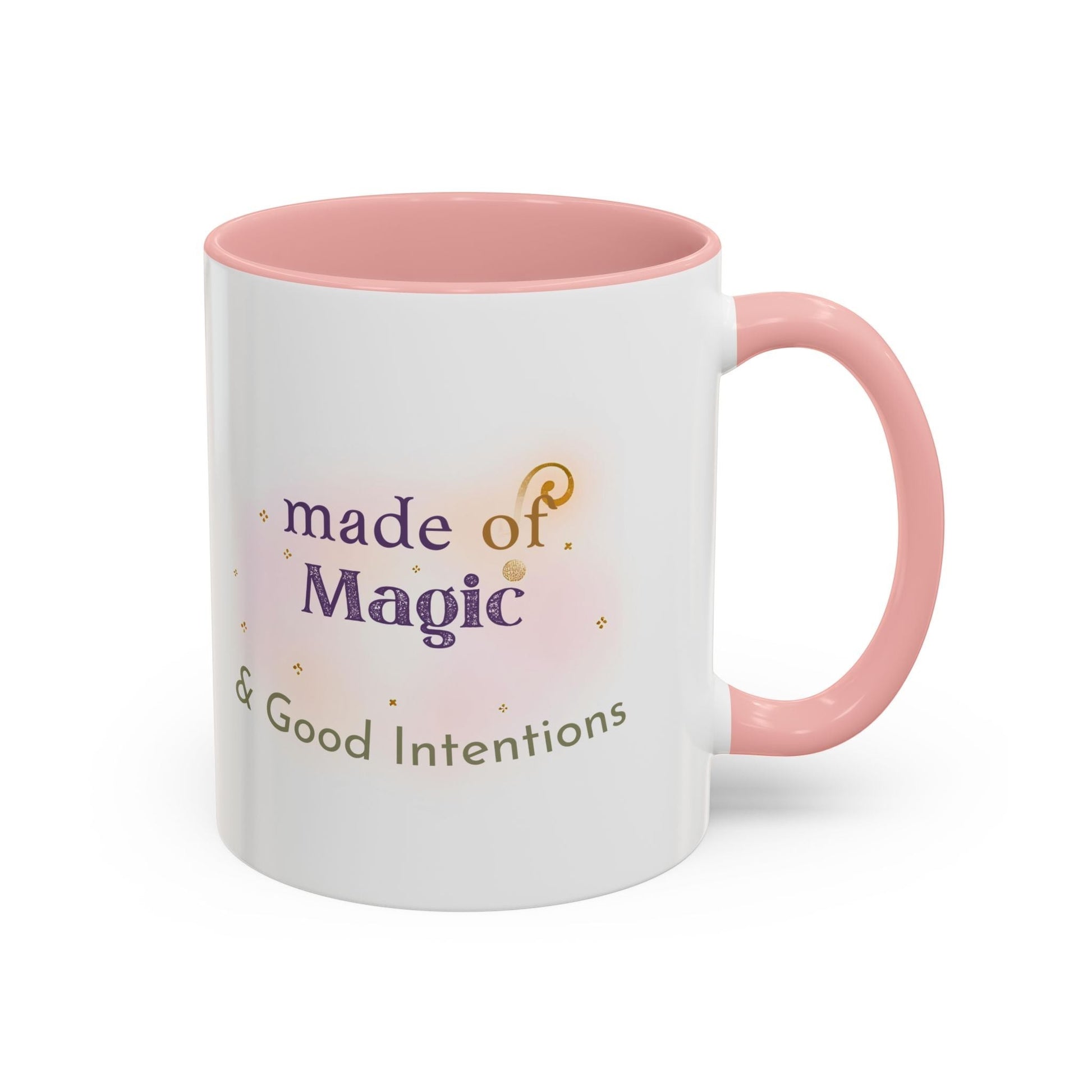 Jena Jewelry white ceramic mug with pink interior and handle, featuring "made of Magic & Good Intentions" text and watercolor accents.
