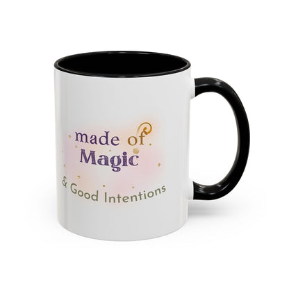Jena Jewelry white ceramic mug with black interior and handle, featuring "made of Magic & Good Intentions" text and watercolor accents.