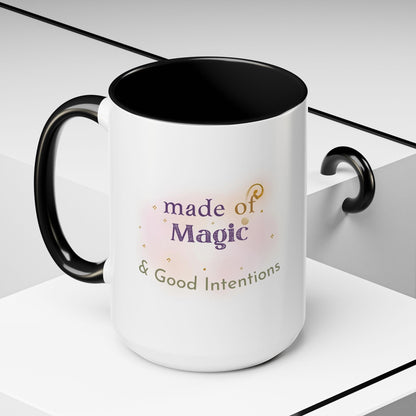 Jena Jewelry white ceramic mug with black interior and handle, featuring "made of Magic & Good Intentions" text and watercolor accents.