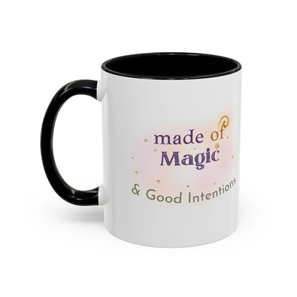 Jena Jewelry white ceramic mug with black interior and handle, featuring "made of Magic & Good Intentions" text and watercolor design.