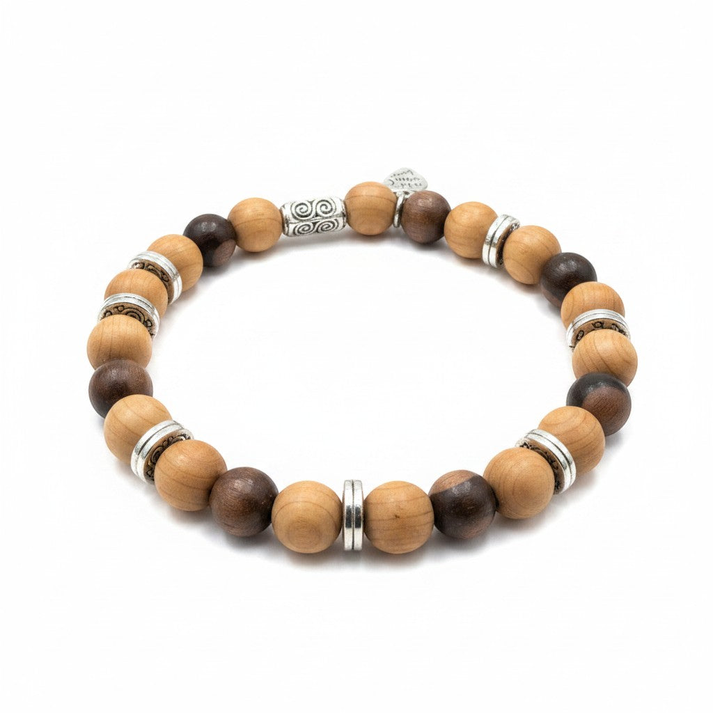Jena Jewelry stretch bracelet with alternating dark brown tiger ebony and light brown Thuja Sutchuenensis wood beads, separated by silver spacers.