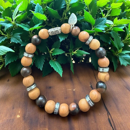 Jena Jewelry stretch bracelet with dark brown Tiger Ebony and light brown Thuja Sutchuenensis wood beads, accented with silver spacers.
