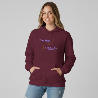 Jena Jewelry maroon cotton-poly blend hoodie with "Tiny Steps Still Move You Forward" graphic and footprint design.