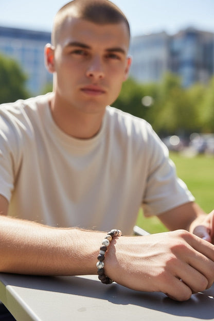 Jena Jewelry "I Love You" Morse code bracelet with coffee jasper, ebony mala, and hematite beads on a man's wrist.