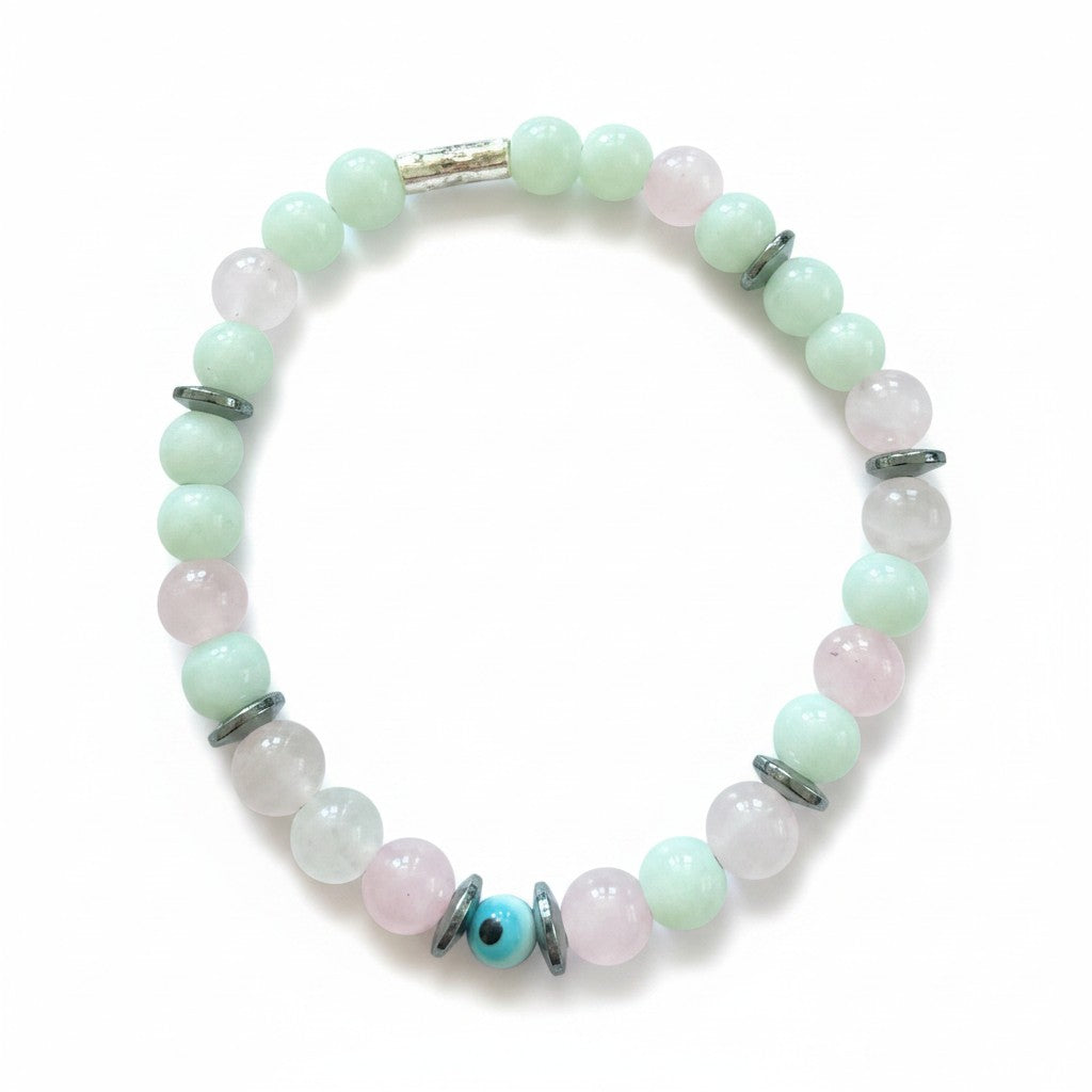 Jena Jewelry bracelet with light green jade, pink rose quartz, and hematite beads spelling 'F*ck Off' in Morse code. Features a central blue evil eye bead.
