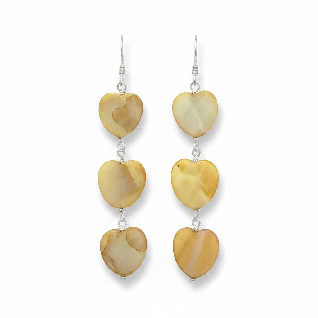 Jena Jewelry tea-dyed mother of pearl heart dangle earrings with silver hooks. Natural, feminine grace.