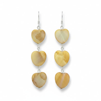 Jena Jewelry tea-dyed mother of pearl heart dangle earrings with silver hooks. Natural, feminine grace.