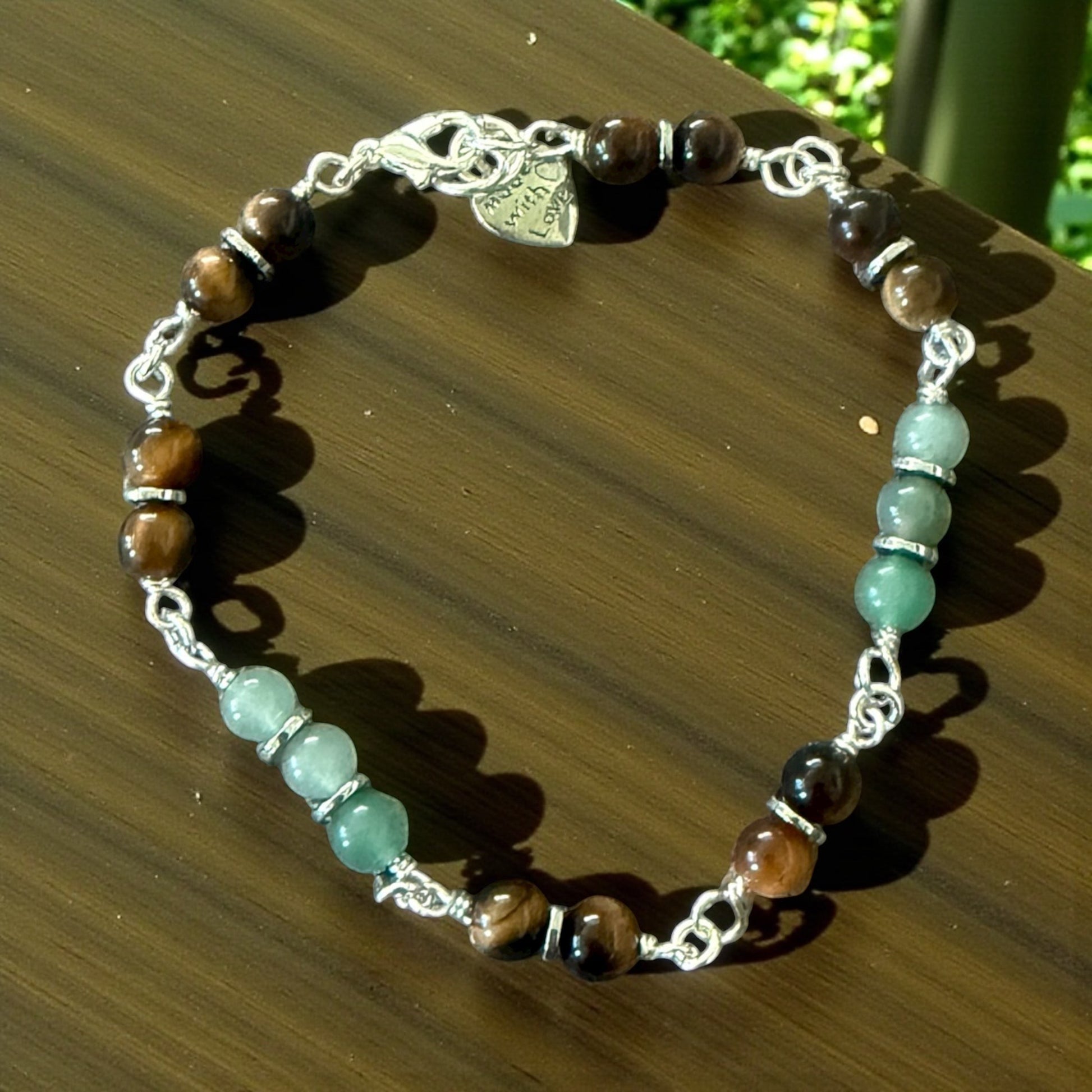 Jena Jewelry hand-wrapped bracelet with tiger eye and green aventurine beads, silver chain and clasp with "Made with Love" charm.