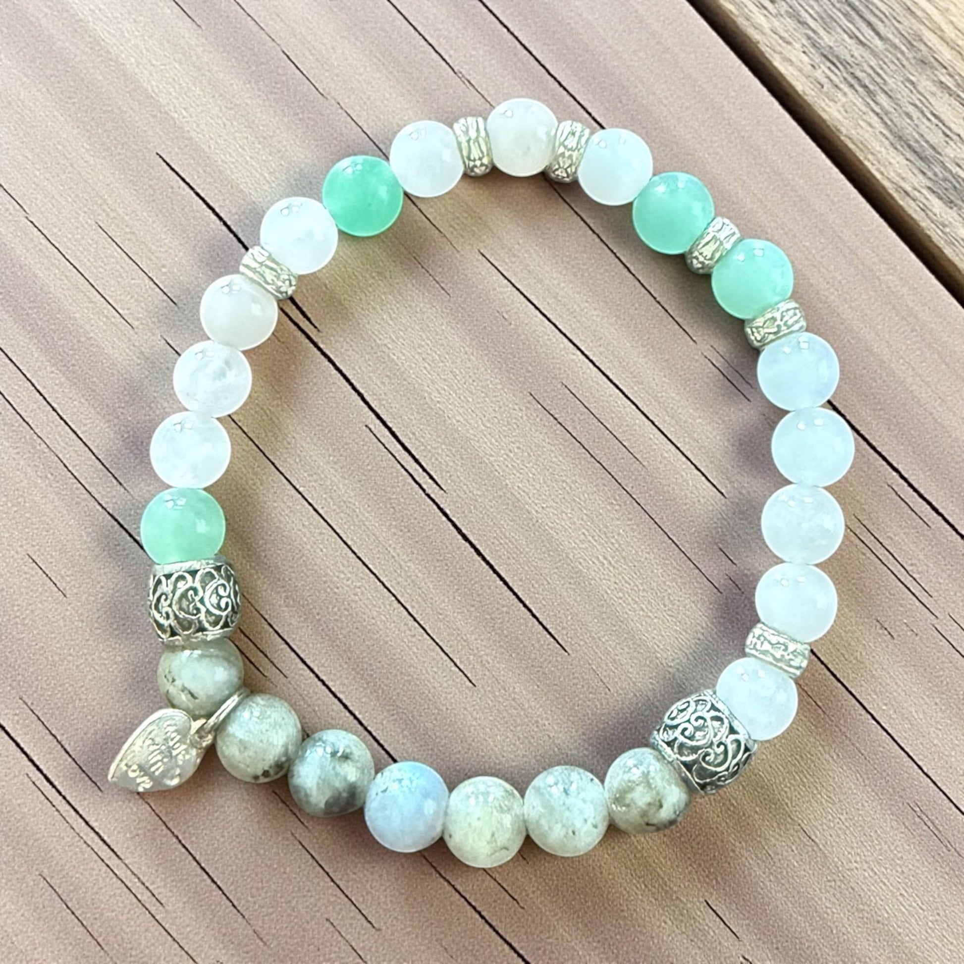 Jena Jewelry "Peace" Morse code bracelet with green aventurine, white quartz, and sesame jasper beads, silver spacers, and a heart charm.
