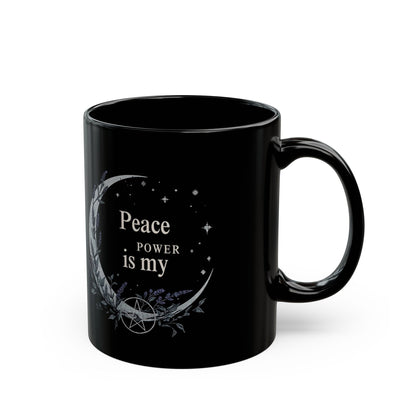 Jena Jewelry black ceramic mug with "Peace Is My Power" text, crescent moon, stars, and pentagram design.
