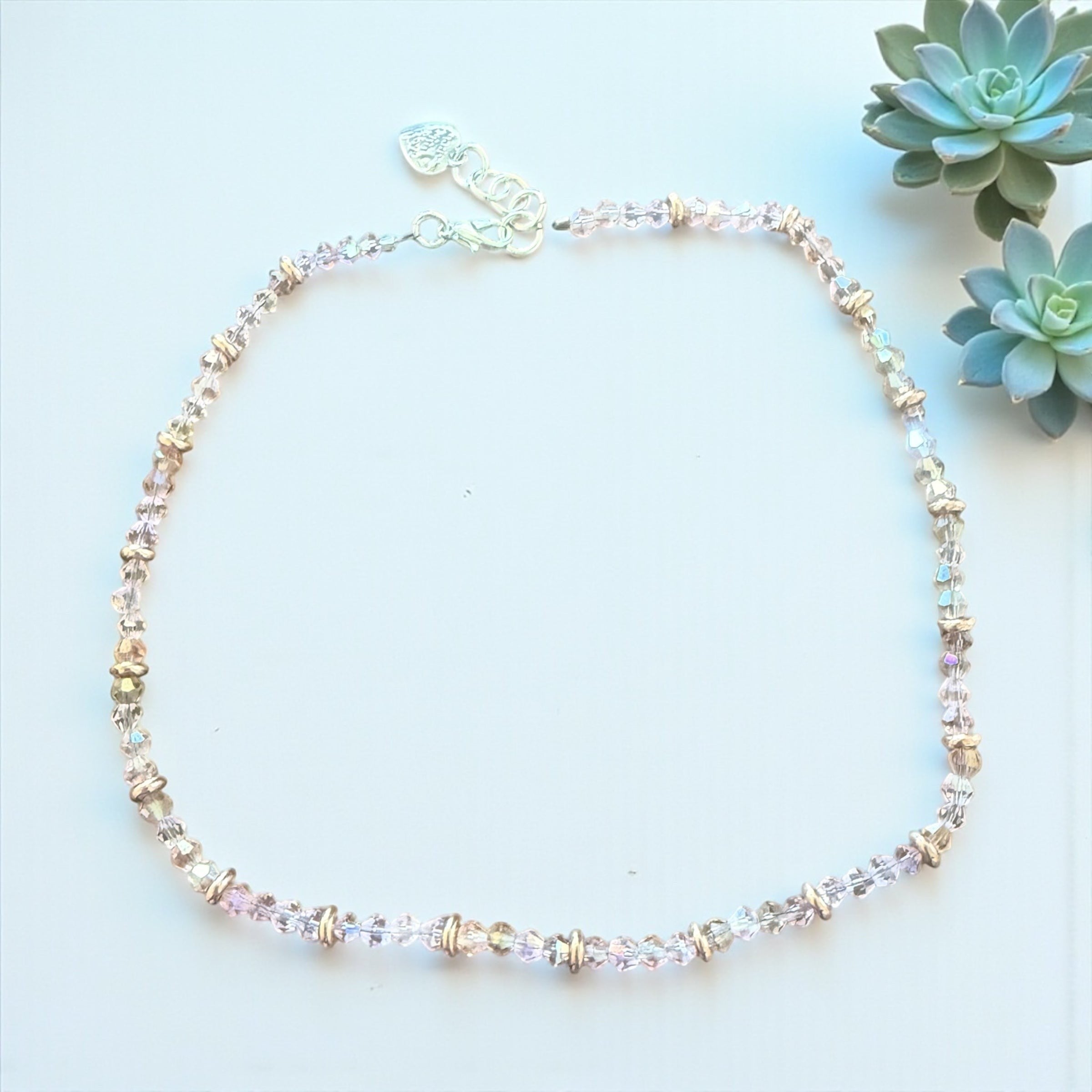 Jena Jewelry delicate pink crystal necklace with rose gold tone spacers, adjustable silver clasp and heart charm.