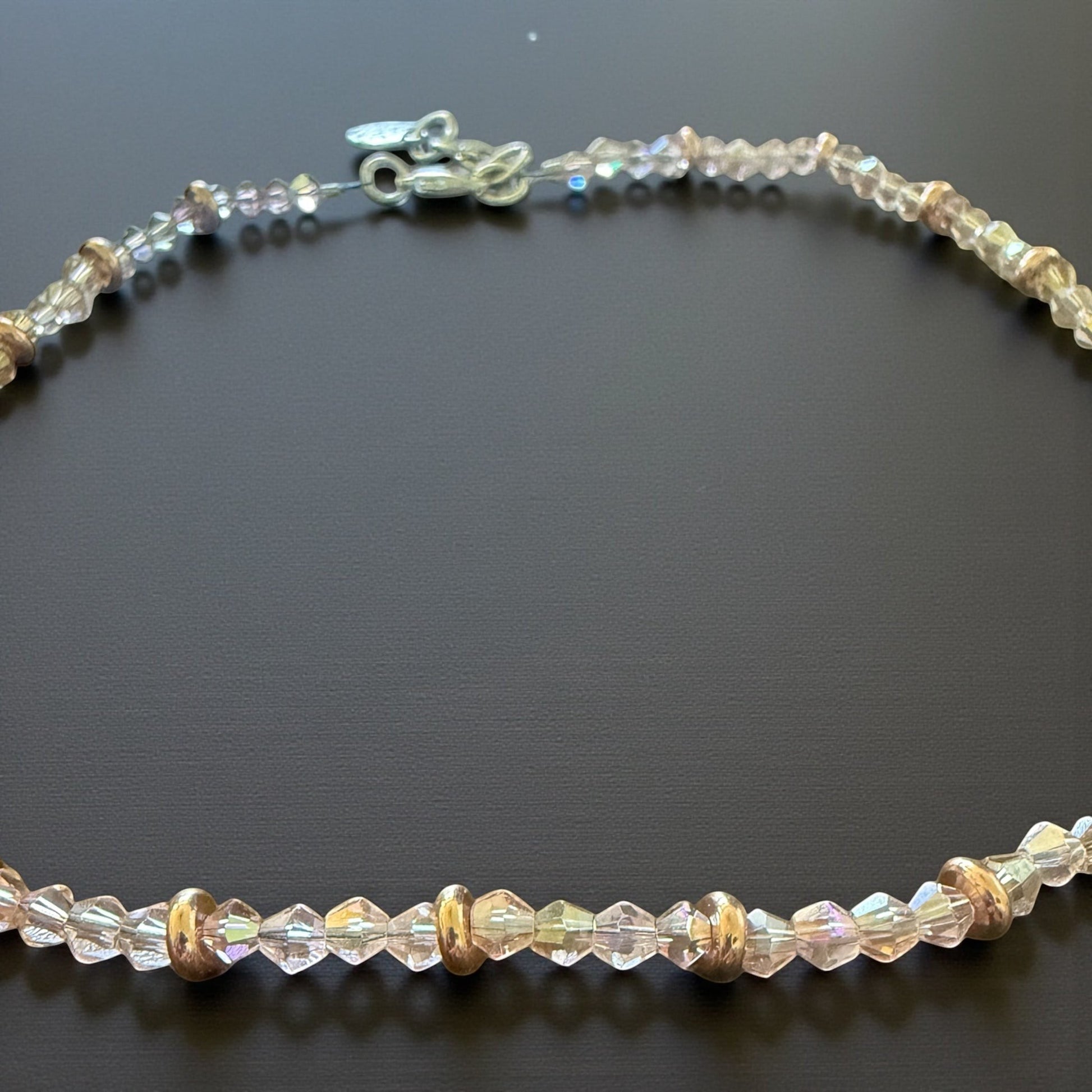 Jena Jewelry delicate pink crystal necklace with rose gold spacers, featuring faceted crystals and smooth rondelles.