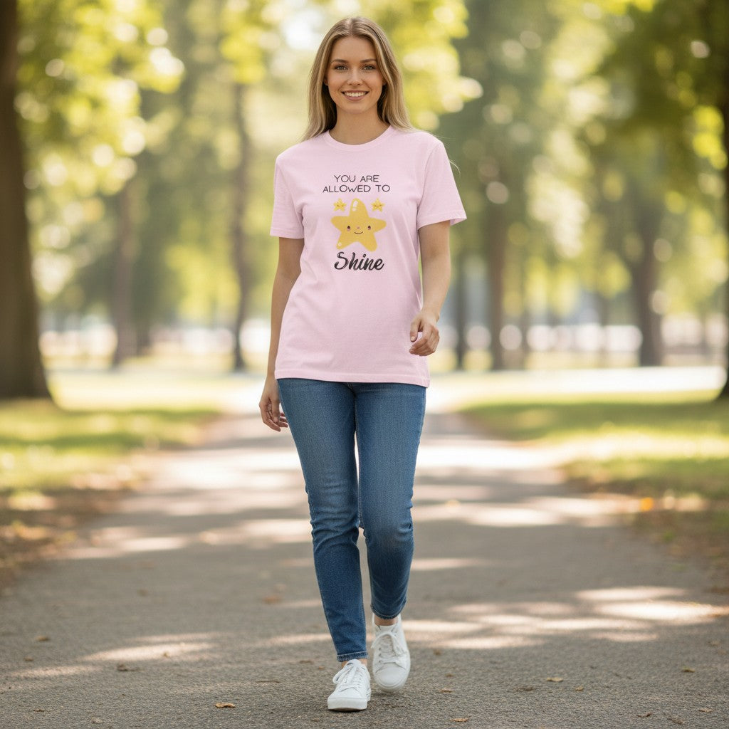 Jena Jewelry pink 100% cotton youth t-shirt with a graphic of a smiling star and text "You Are Allowed to Shine".