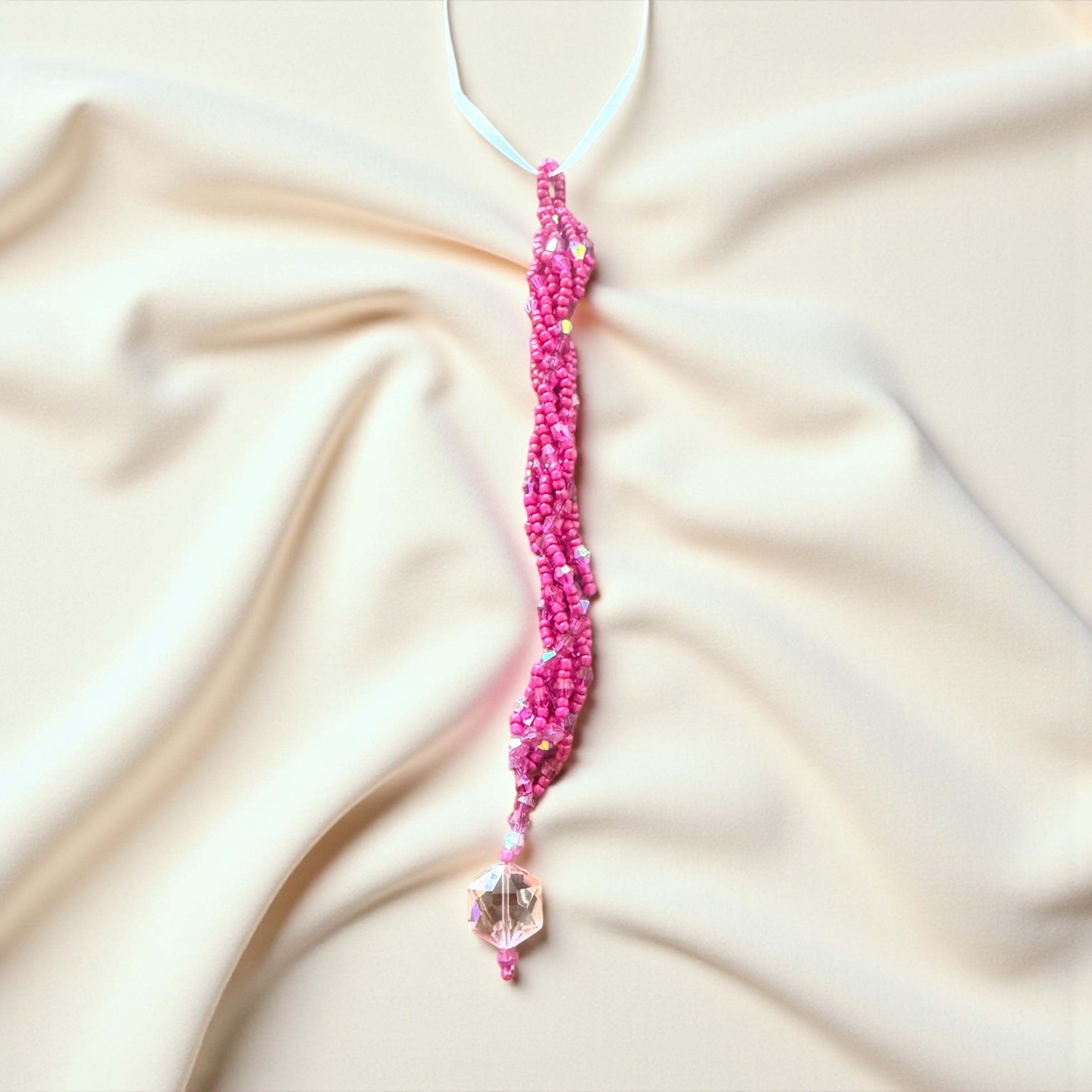 Jena Jewelry pink seed bead icicle ornament with a faceted crystal charm, handcrafted for holiday sparkle.