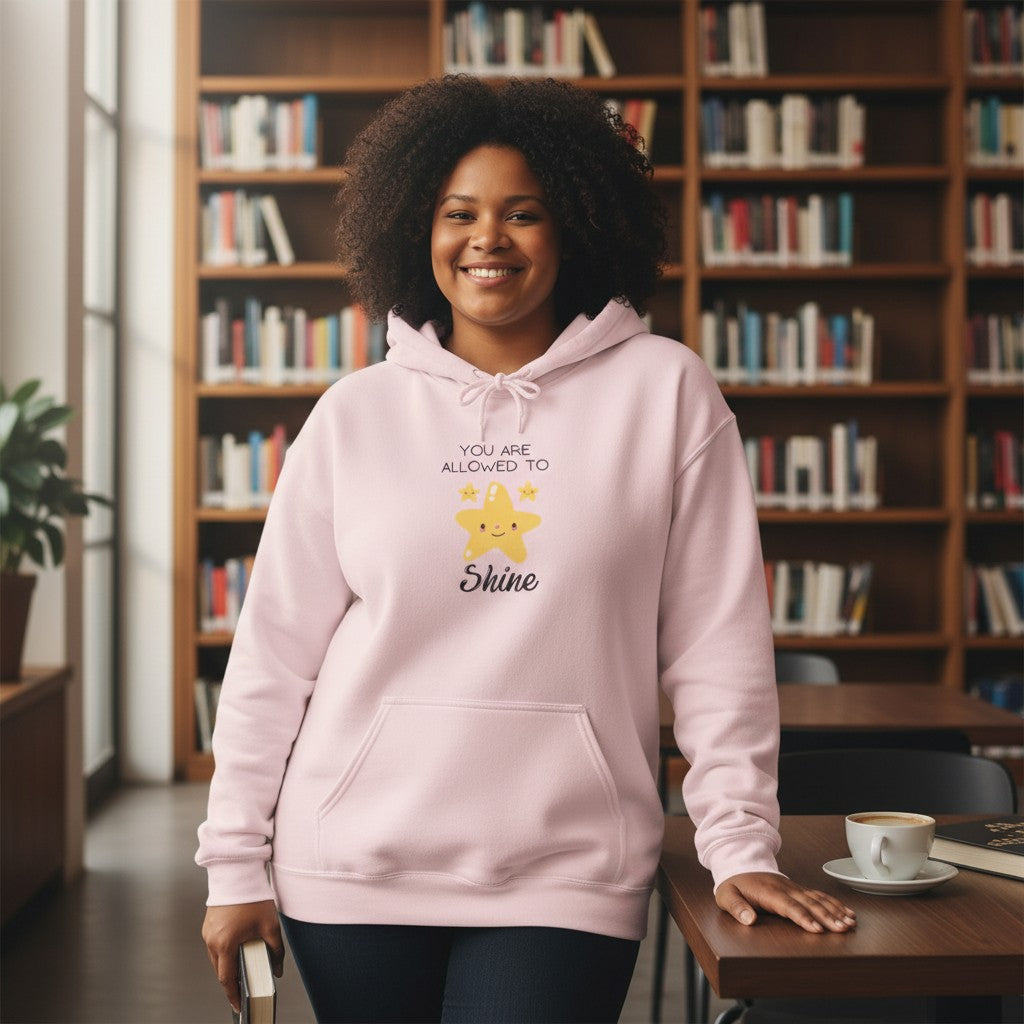 Jena Jewelry light pink cotton-poly blend hoodie with a cute smiling star graphic and the text "You Are Allowed To Shine."