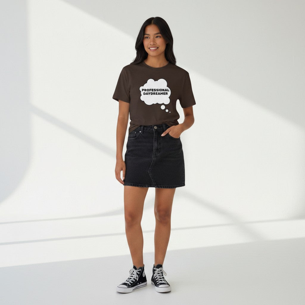 Jena Jewelry brown 100% cotton t-shirt with white thought bubble graphic saying "PROFESSIONAL DAYDREAMER"