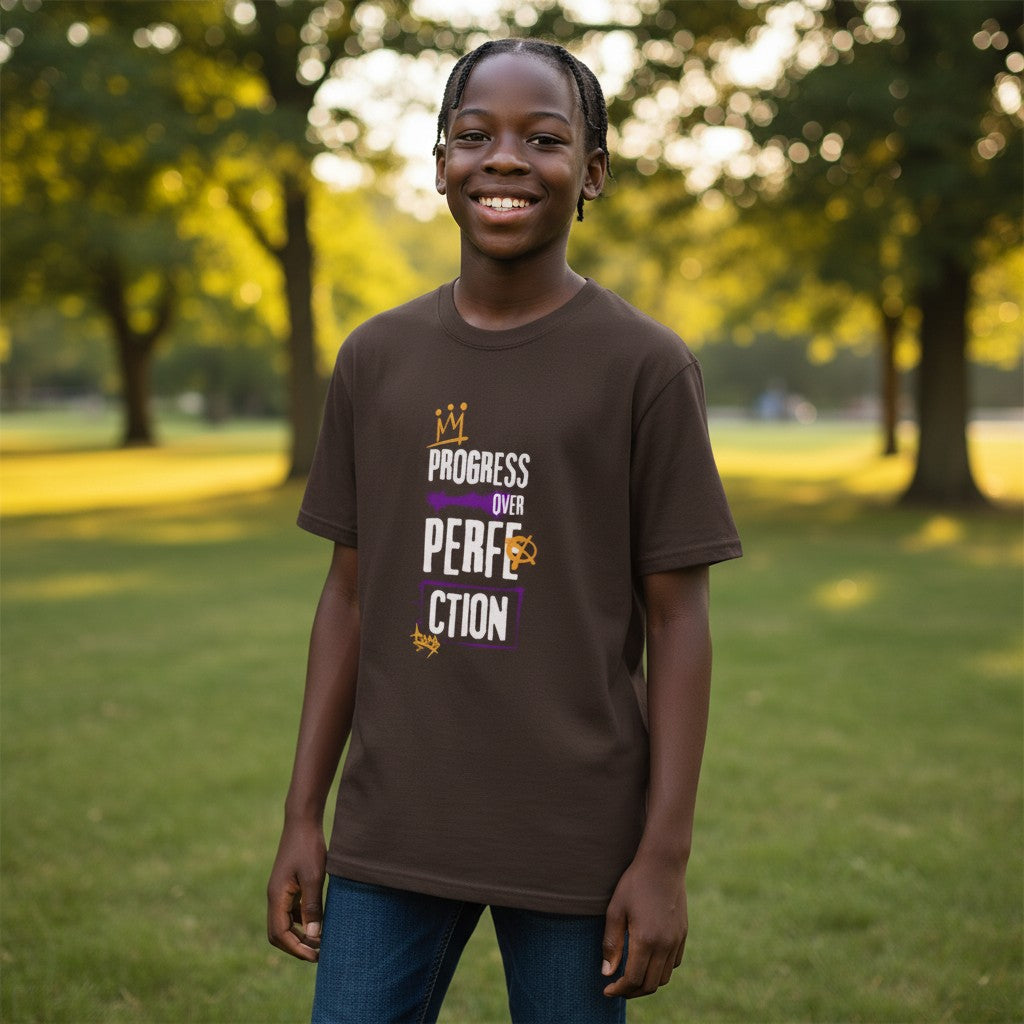 Jena Jewelry brown 100% cotton t-shirt with "Progress Over Perfection" graphic in purple and gold. Relaxed fit, crew neck.