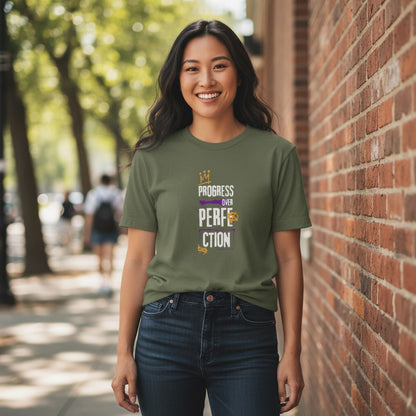 Jena Jewelry olive green 100% cotton t-shirt with "Progress Over Perfection" graphic in purple and gold.